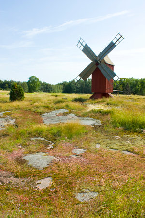 Old windmill in an open area in Finlandの写真素材