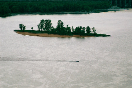 Natural landscape with river, fields and trees at sunsetの写真素材