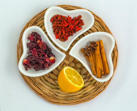 Traditional ingredients for tea, lemon and spices (thyme, oregano, cinnamon, etc.)の写真素材