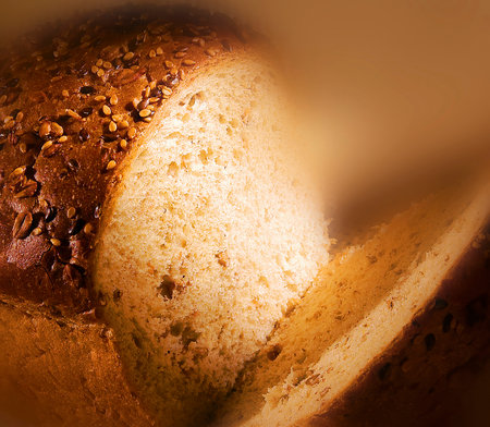 Sliced ââbread with sesame seeds shot in unusual lightの写真素材