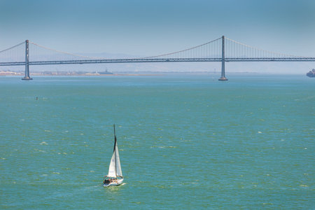 Yacht in San Pablo Bay near San Francisco and Alcatraz Island with the Golden Gate Bridge in the...