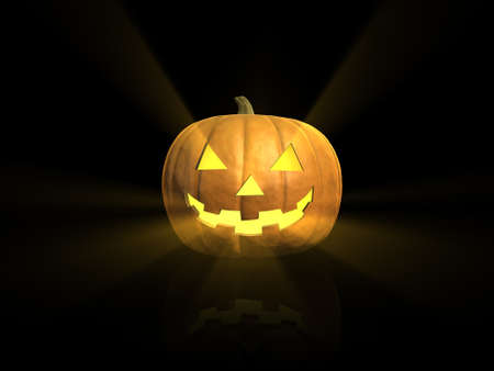 Jack-o-lantern pumpkin with rays of light coming out of its face isolated on black with reflectionの写真素材