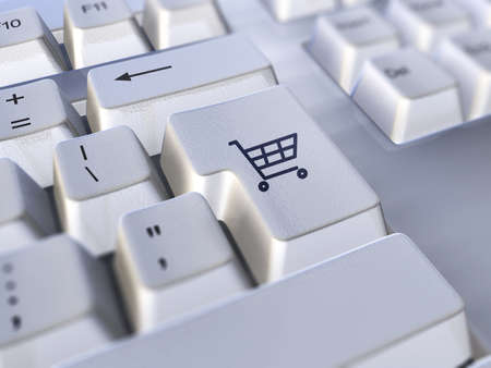 clsoe-up of keyboard with the enter key replaced with a shopping cart icon. E-commerce conceptの写真素材