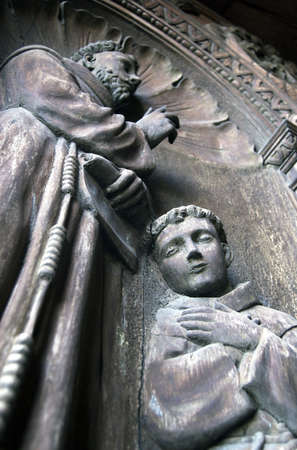 Wooden sculptures on an old church door  