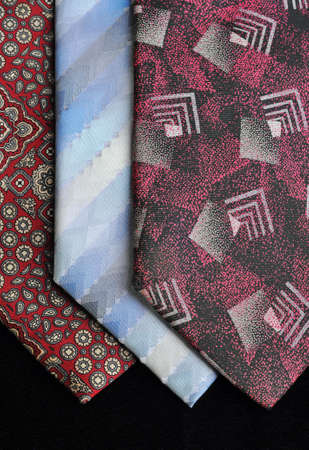 Ties in various tones and patterns, on a black background  の写真素材