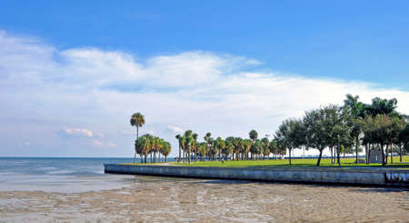 Beach walkway with a low-tide ocean in St  Pete, Florida  の写真素材