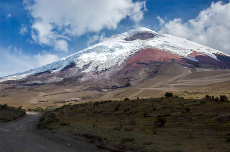 View of the majestic Cotopaxi volcano  highest active volcano in the world  on a sunny and cloudy dayの写真素材