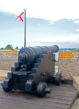 Old canon aiming at the sea on an overcast day, Castillo de San Marcos, St. Augustine, Florida, 16th...