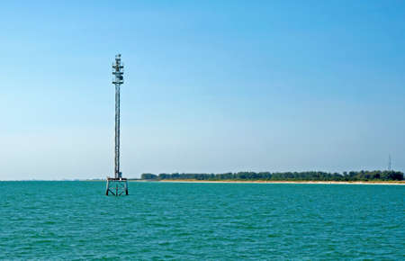 Water tower in the middle of the ocean on a sunny day, Fort De Soto, Floridaの写真素材