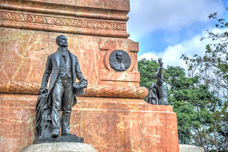 Statues surrounding a national public monument on a sunny day, in Guayaquil, Ecuadorの写真素材