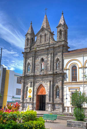 Old colonial church facade, on a sunny morning, blue sky, in Ibarra Ecuador.の写真素材