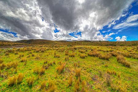 Wide angle of view of the Cotopaxi volcano and the Cotopaxi National Park, on a sunny and overcast morningの写真素材