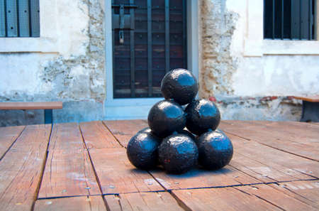 Metal cannon ball bullets in a bunch, on display at the old Castillo de San Marcos fort, in Saint Augustine, Florida, United States.の写真素材