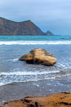 Rocks of all sizes with the ocean and sky in the background, on an overcast day, at the Los Frailes Beach National Park, Manabi, Ecuadorの写真素材