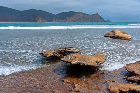 Rocks of all sizes with the ocean and sky in the background, on an overcast day, at the Los Frailes Beach National Park, Manabi, Ecuadorの写真素材