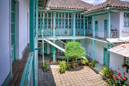 Guaranda, Bolivar province, Ecuador - November, 2013: An old colonial and traditional house, with many doors, hallways, windows, balconies and interior patios.のeditorial素材
