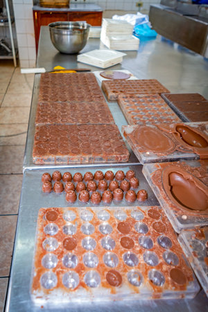 Chocolate production in molds at a local chocolate factory in Guaranda, Ecuador.の写真素材