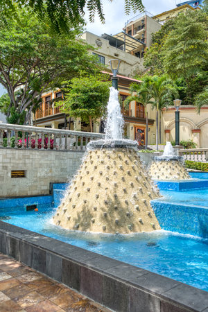 Guayaquil, Guayas, Ecuador - November 2013: Water fountain in a public space near an area of the pier boardwalk in Guayaquil, on a sunny morning.のeditorial素材