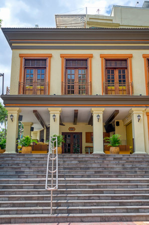 Guayaquil, Guayas, Ecuador - November 2013: Facade of a replica of an old traditional house in Guayaquil, named "Casa Pilsener" meaning "Pilsener House", with frontal steps and many windows.のeditorial素材