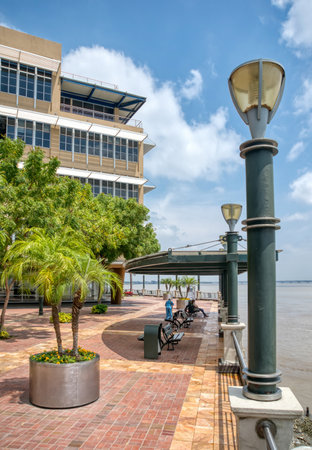 Guayaquil, Guayas, Ecuador - November 2013: View of an area of the Guayaquil pier with the Guayas river in the scene, on a cloudy and sunny morning.のeditorial素材