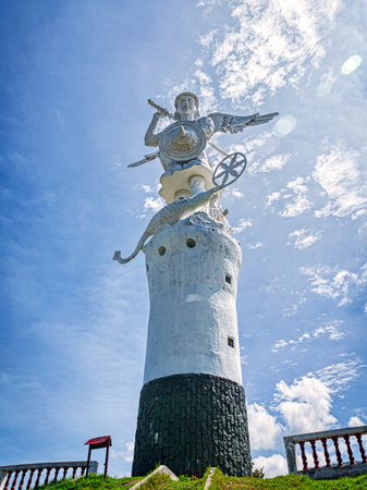 Ibarra, Imbabura, Ecuador - November, 2013: Statue of archangel Michael, on a sunny summer morning. The statue is at the top of a hill looking over the city.のeditorial素材