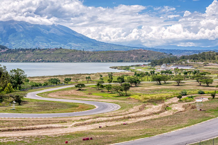 Abandoned Yahuarcocha race car circuit, with the Yahuarcocha lake in the background, on a beautiful sunny morning. Yahuarcocha, Imbabura province, Ecuador.の写真素材