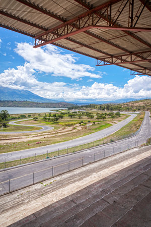 Abandoned Yahuarcocha race car circuit, with the Yahuarcocha lake in the background, on a beautiful sunny morning. Yahuarcocha, Imbabura province, Ecuador.の写真素材