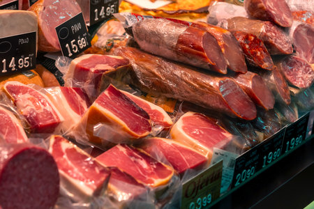Madrid Local Market (Villa de Vallecas): A vibrant Spanish food hall showcasing diverse stalls with premium meats, poultry, fresh seasonal vegetables and regional delicacies.の写真素材