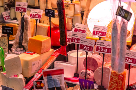 Madrid Local Market (Villa de Vallecas): A vibrant Spanish food hall showcasing diverse stalls with premium meats, poultry, fresh seasonal vegetables and regional delicacies.の写真素材