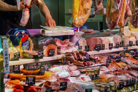 Madrid Local Market (Villa de Vallecas): A vibrant Spanish food hall showcasing diverse stalls with premium meats, poultry, fresh seasonal vegetables and regional delicacies.の写真素材