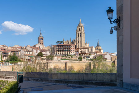 A far away view of Segovia's downtown from the front plaza of the Alcazar castle, providing a sweeping panorama of the historic Segovian city skyline and the distant downtownの写真素材
