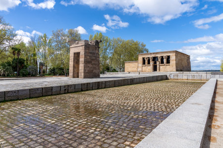 The Temple of Debod in Madrid, an ancient Egyptian monument, shows two weathered stone pylons and...