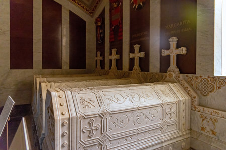 White marble sarcophagi of Spanish princes and princesses lie within the Pantheon of the Infantes at...