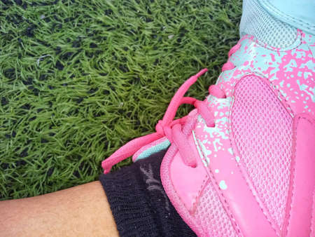 pink shoes on the grassの写真素材