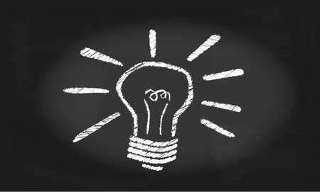 A blackboard with a drawing of an inspirational glowing light bulb のイラスト素材