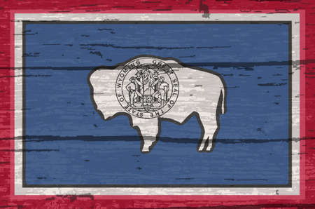 The flag of the USA state of Wyoming on a wooden backgroundの写真素材