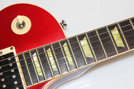 Close up of a typical solid body electric guitar