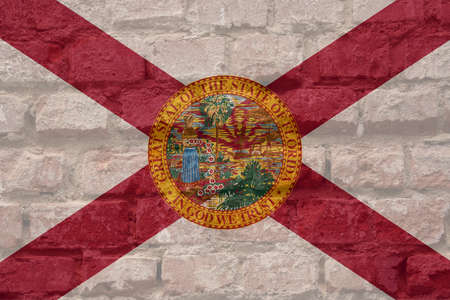 The flag of the USA state of Florida painted onto a brick wallの写真素材