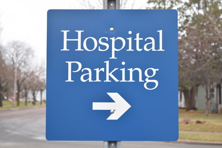 Hospital Parking Sign With Arrow Blue In Colorの写真素材