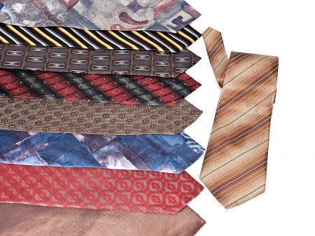 A lot of diverse neckties lying in a row  Isolated on white background の写真素材