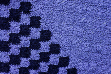 Knitted fabric with a pattern of blue and dark blue yarn  Crochet knitting の写真素材