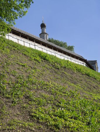 Wall and temple of Christian monastery on a high hillの写真素材