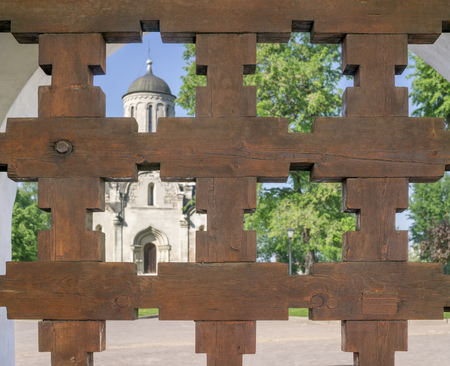 Temple of Christian monastery through wooden lattice gatesの写真素材