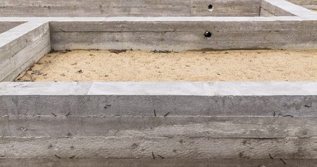 Fragment of concrete foundation new building.Focus is on foregroundの写真素材