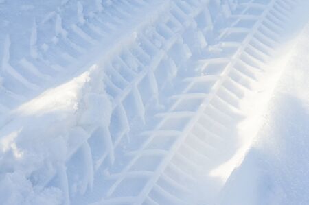 Tracks car tyre in snow.Small depth of fieldの写真素材