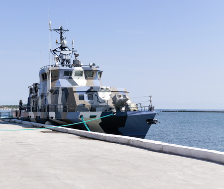 Military patrol ship at pier.Sunny dayの写真素材