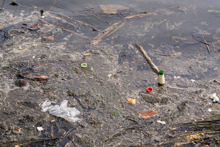 Dirty water with floating garbage. Pollution Environmentの写真素材