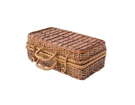 Wicker retro suitcase or trunk isolated on white backgroundの写真素材