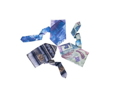 Men's neckties with different patterns lie in form of triangle, isolated on white backgroundの写真素材
