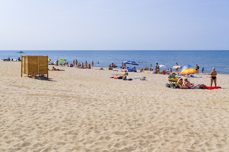 YANTARNY VILLAGE, RUSSIA - AUGUST 6, 2015: Public beach on coast of Baltic Sea. Widest in Kaliningrad region sandy beach first in Russia to receive Blue Flagのeditorial素材